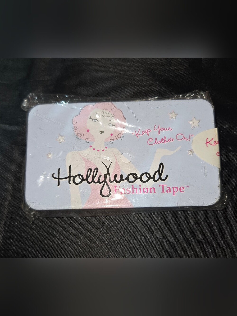 Hollywood Fashion Tape In A Collectable Metal Tin Case.